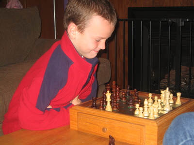 Tyrian plays chess (with dad, not pictured here)
