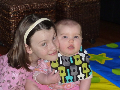Allyndreth and Evya playing on the mat