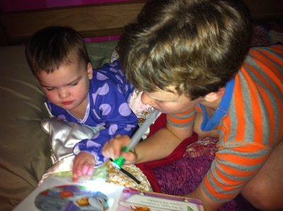 Caught reading when we're supposed to be going to sleep.