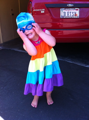 Evya's dressing up for swim team practice