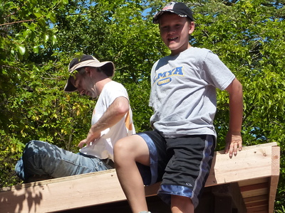 Tyrian and Matt building the shed roof