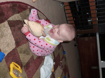 Evya plays with Sweater Puppy